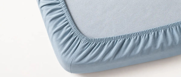 An image showing the elastic grip of a crib sheet