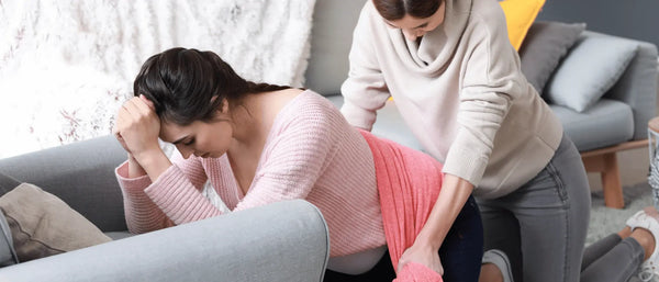 An image of a Doula comforting a pregnant woman