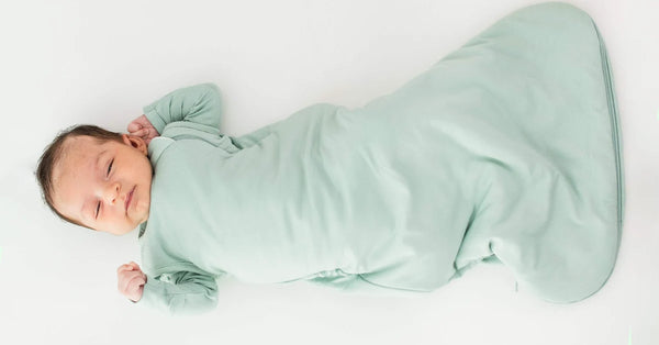 An image of a baby in a sleep sack
