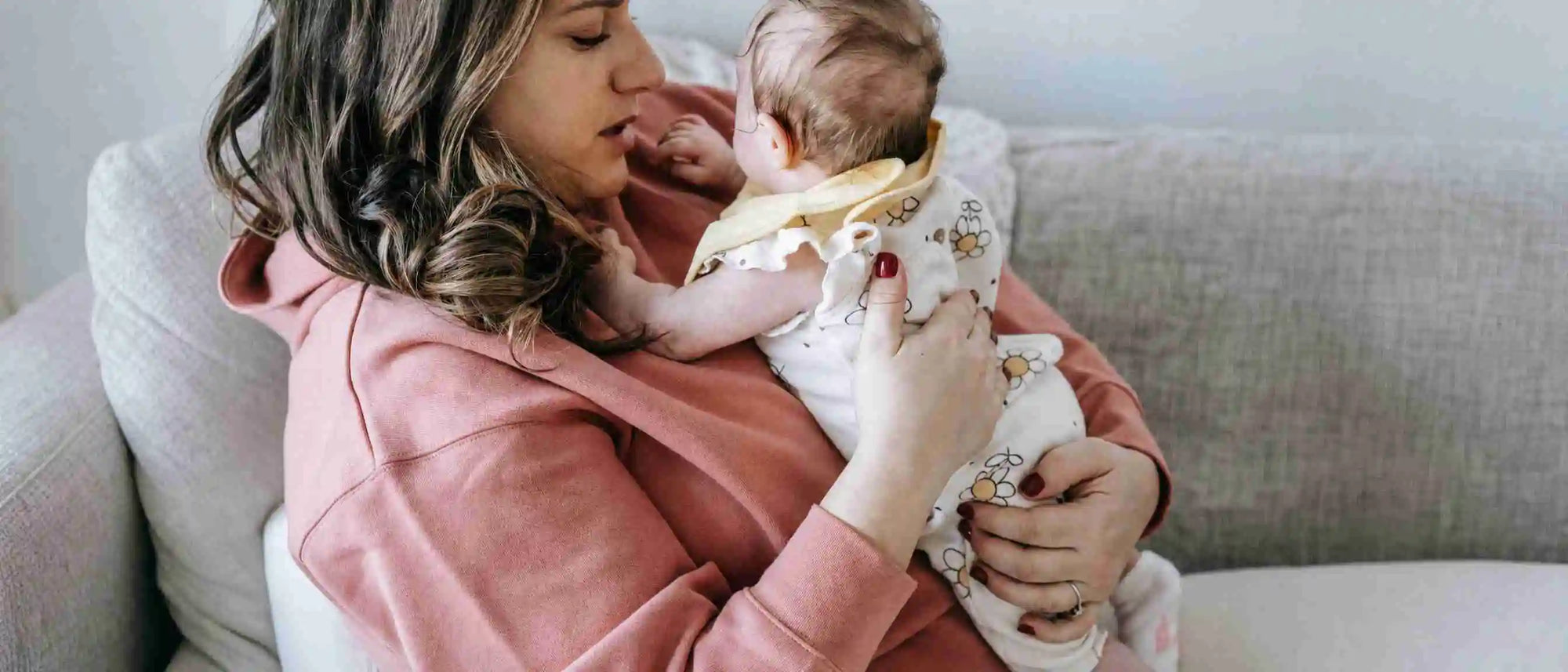 A mother putting a crying baby to rest
