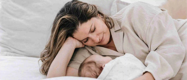 An image of a new mom adoring her baby