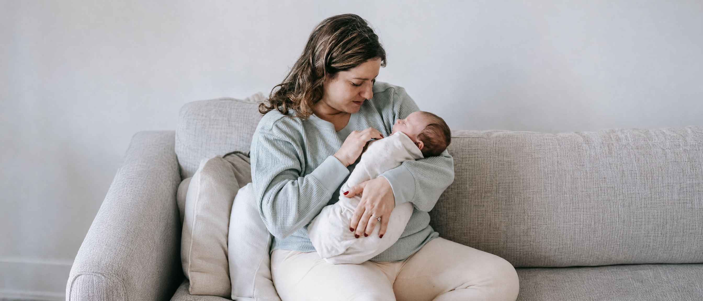 A mother putting the baby to sleep
