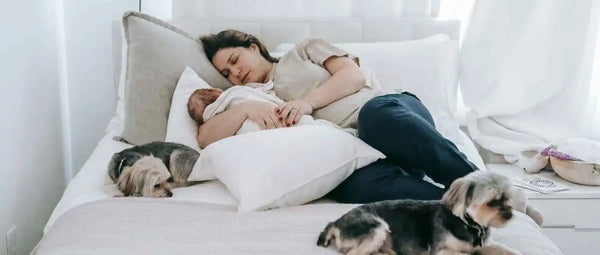 A mother side-lying breastfeeding
