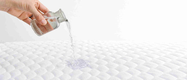 An image showing water-proof bassinet mattress pad