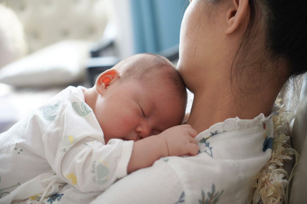 A mother with her baby at home