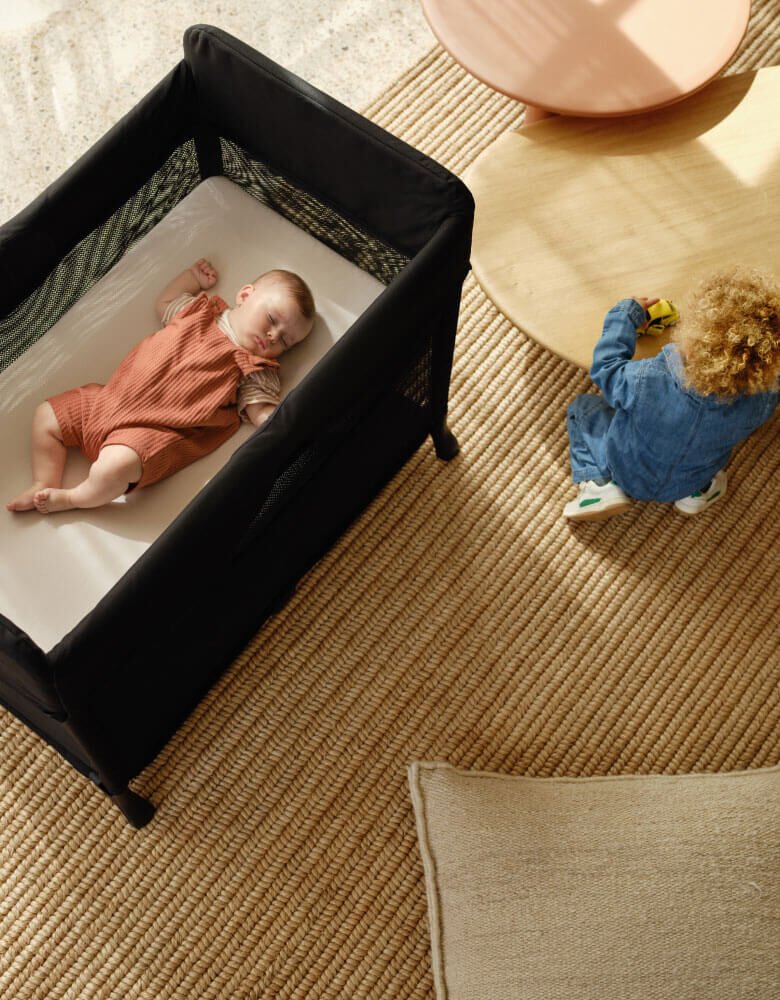 Baby asleep in a Bugaboo Stardust Play Yard