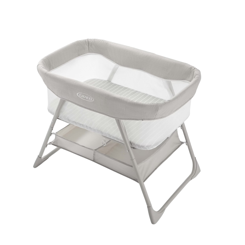 A Joey + Joan fitted sheet in a crib beside a chest of drawers